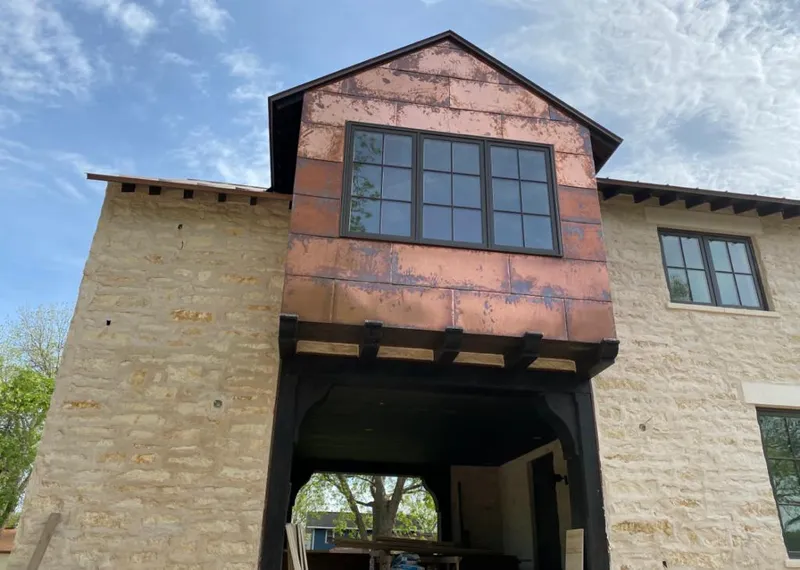 Copper metal panel facade on a stone building for Skylight Installation in Melrose Park